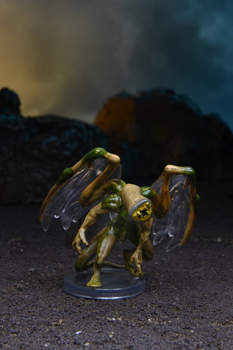 Mini figure of a Garaggakal, an alien with large wings and clawed hands, and a large round mouth full of teeth