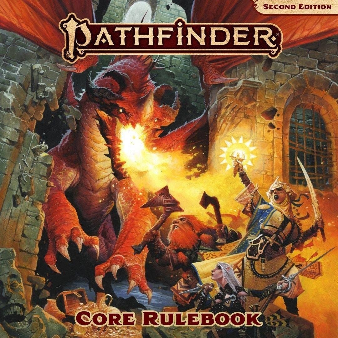 Pathfinder Second Edition Core Rulebook Cover, Pathfinder Iconics battle a red dragon breathing fire through a crumbling stone wall