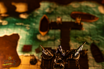 A top down view of a square tiled map with mini figures