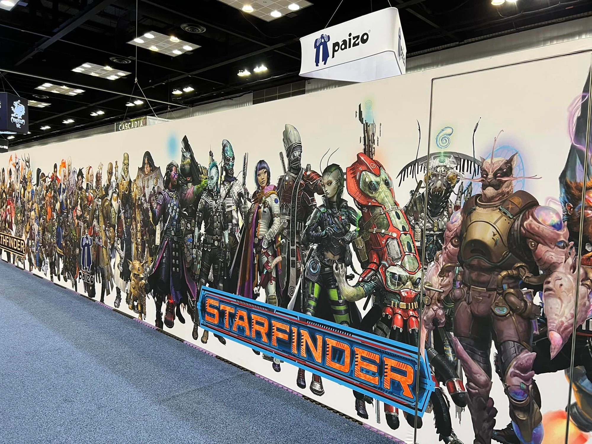 The Back of the Paizo Booth wall featuring all the Pathfinder and Starfinder Iconics
