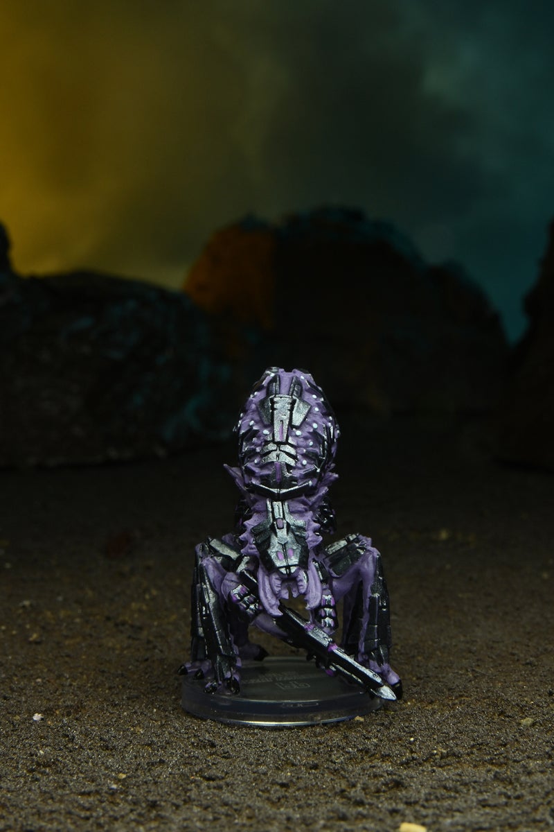 Mini figure of a Jinsul Warrior a medium purple alien with six legs, wielding a large rifle