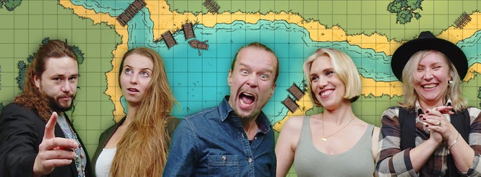 A group photo of the Natural Pengu team in front of a square tiled map of a lakeside