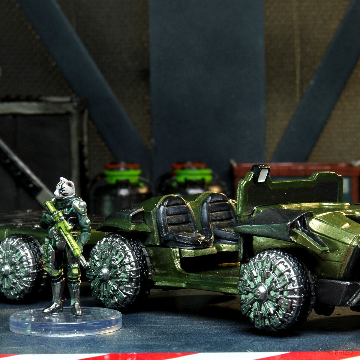 Models set in a docking bay scene featuring the cat-like pahtra guarding a transport vehicle