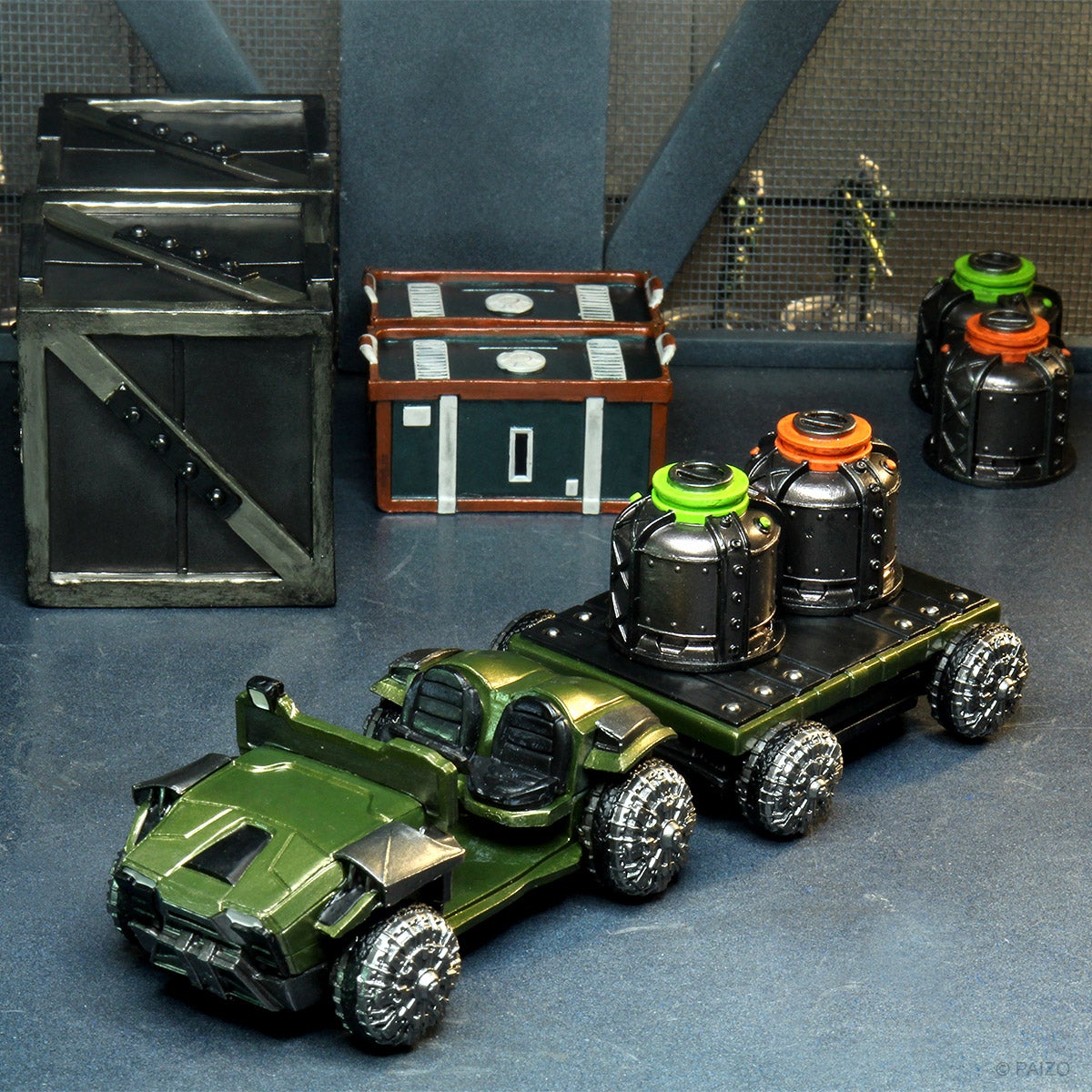 Mini figures set in a docking bay scene, featuring a transport vehicle towing two large bins