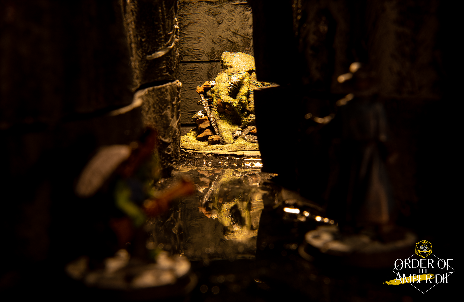 Order of the Amber Die: Close up view of mini figures in a dungeon