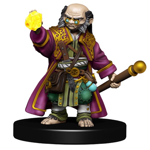 A bald-headed Halfling Wizard with bushy sideburns scowls over his eyeglasses as he raises a glowing yellow gem in his right hand.