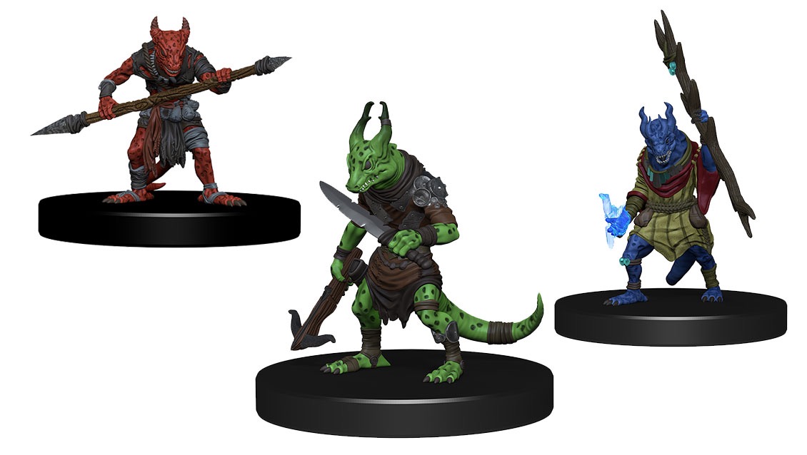 3 kobold miniature figures. On the left, a red kobold holding a staff before him. The staff is pointed on both ends and looks deadly. In the center, a green kobold wields a large dagger in its left hand and a hand crossbow in its right.  On the right, a blue kobold appears to be a spellcaster, wielding a staff high in the air in his left hand while a blue 'glow' comes from his right.