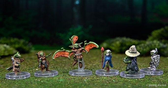 Six painted goblin minis dressed as different classes, investigator, rogue, cleric, wizard, champion, and a winged mutant goblin