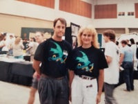 Lisa standing in the middle of a convention show floor