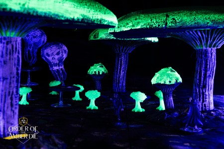 A closeup on the game space glowing under a dark light