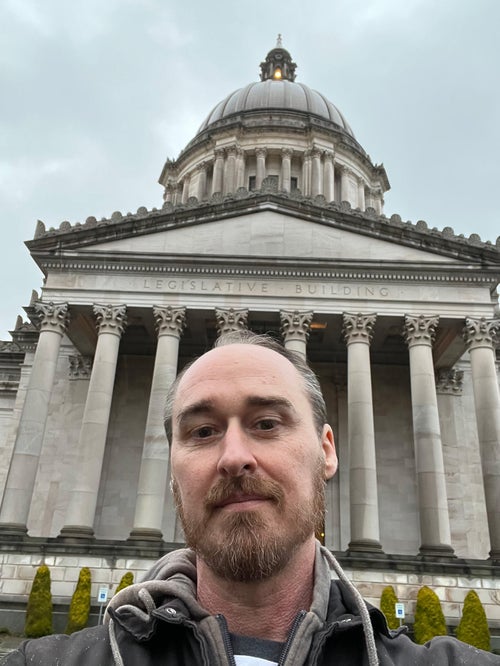 Paizo’s intrepid Director of Narrative, Adam Daigle, takes a selfie outside the Washington State Legislative Building on Legislative Game Day 2025