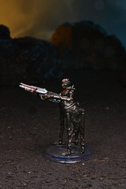 Mini figure of a Formian warrior, an insect-like four legged alien wielding a large rifle