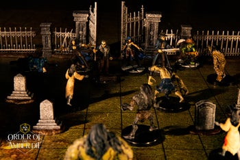 Order of the Amber Die: Player character mini figures standing in a cemetery, surrounded by a hoard of undead