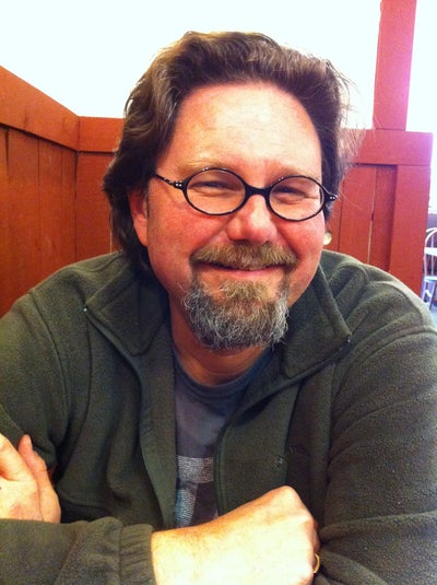 Photo of Gary Teter sitting in a booth