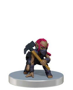 promo mini figure of a pink haired gnome scout dressed in dark wraps and leathers, with a mask over their lower face, crouched with a mattock